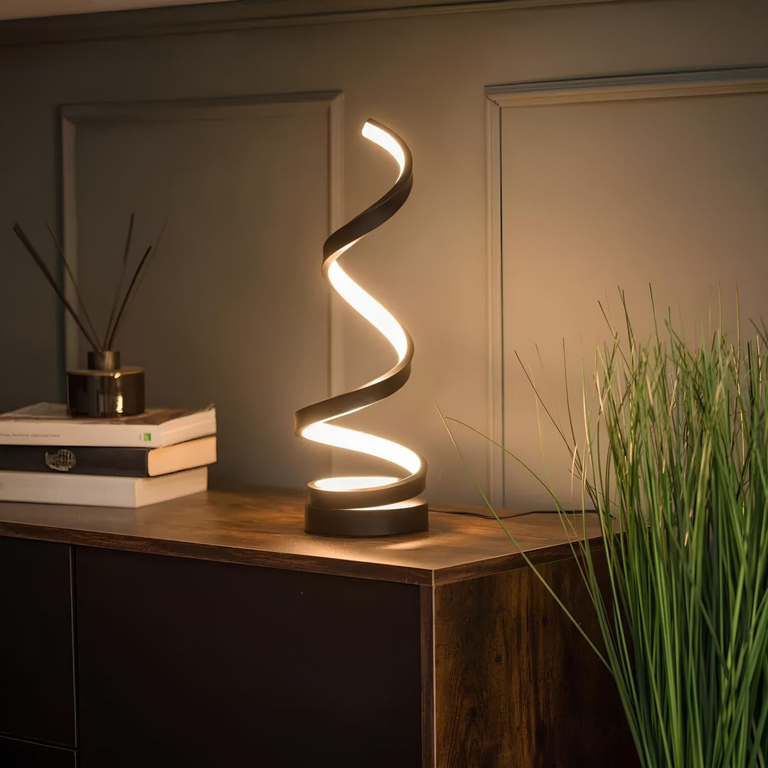 Contemporary spiral desk lamp with warm LED light. Perfect bedside or office accent lighting.