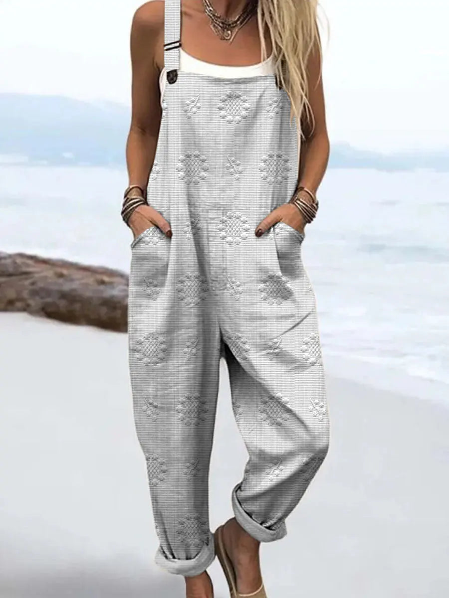 Casual women's wide-leg jumpsuit. Comfortable, flowy design with adjustable shoulder straps for daily spring/summer style.