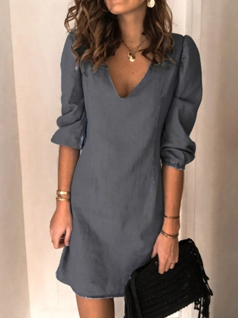 Chic black V-neck casual dress for women, with half sleeves & a comfortable, flattering fit.