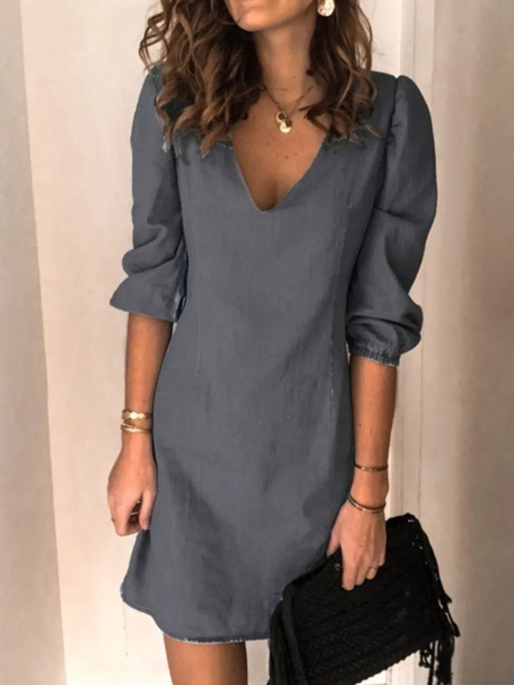 Chic black V-neck casual dress for women, with half sleeves & a comfortable, flattering fit.
