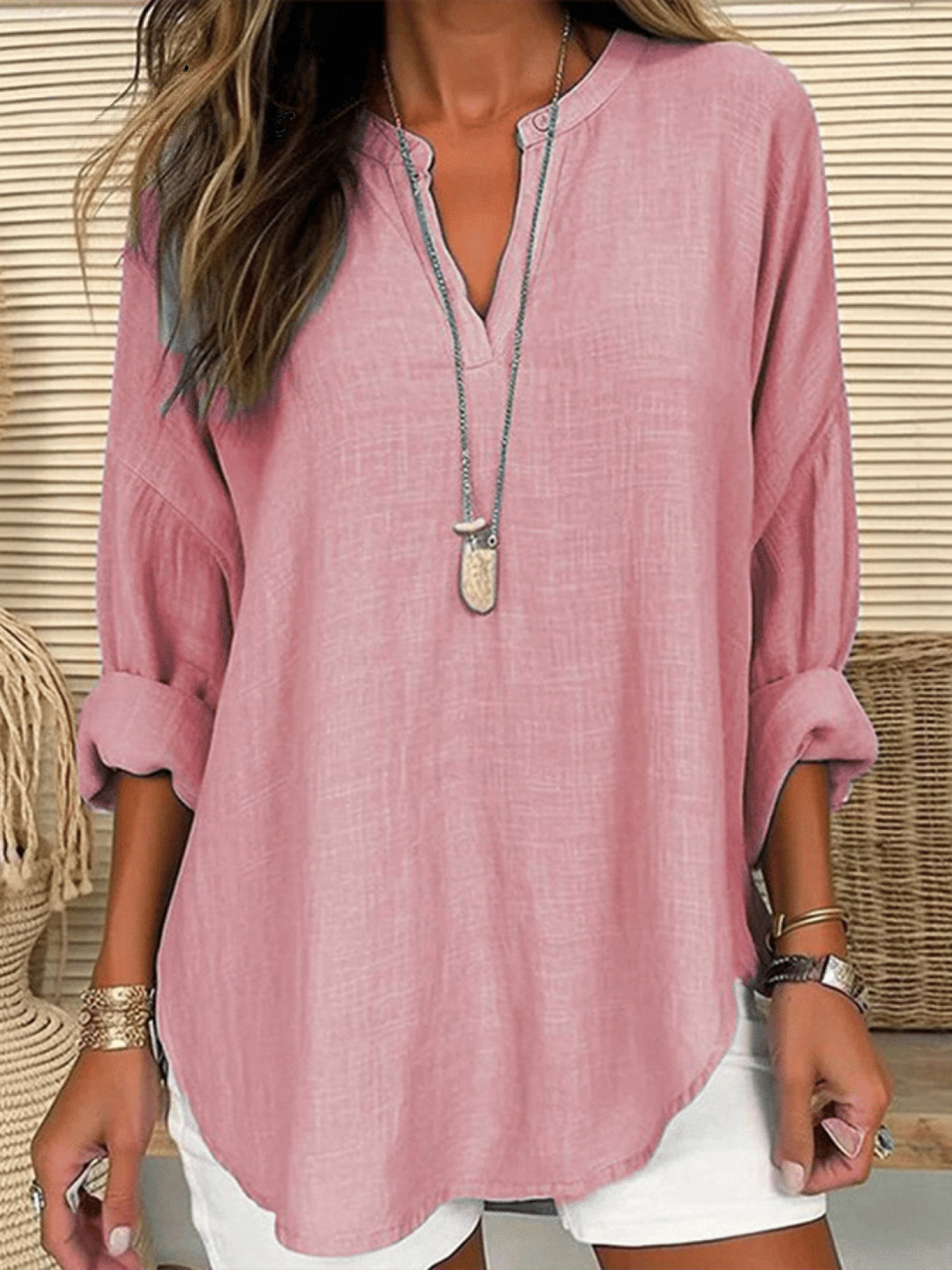 Elegant V-neck long sleeve tunic blouse for women. Relaxed fit design suitable for workwear.