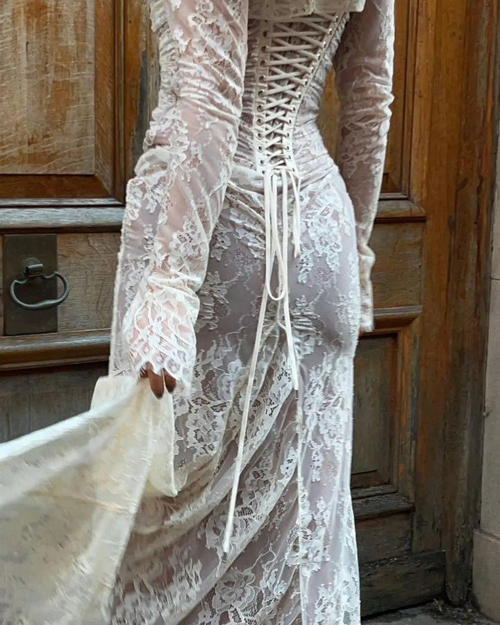 Close-up of intricate lace detail on an elegant women's maxi dress, suitable for special occasion wear.