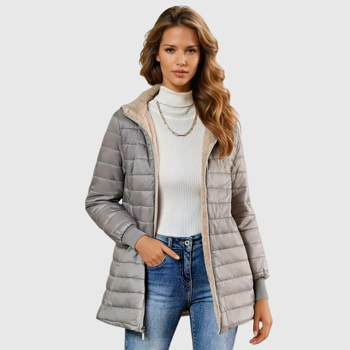 Women's warm quilted puffer jacket with cozy lining, perfect for cold weather winter outerwear.