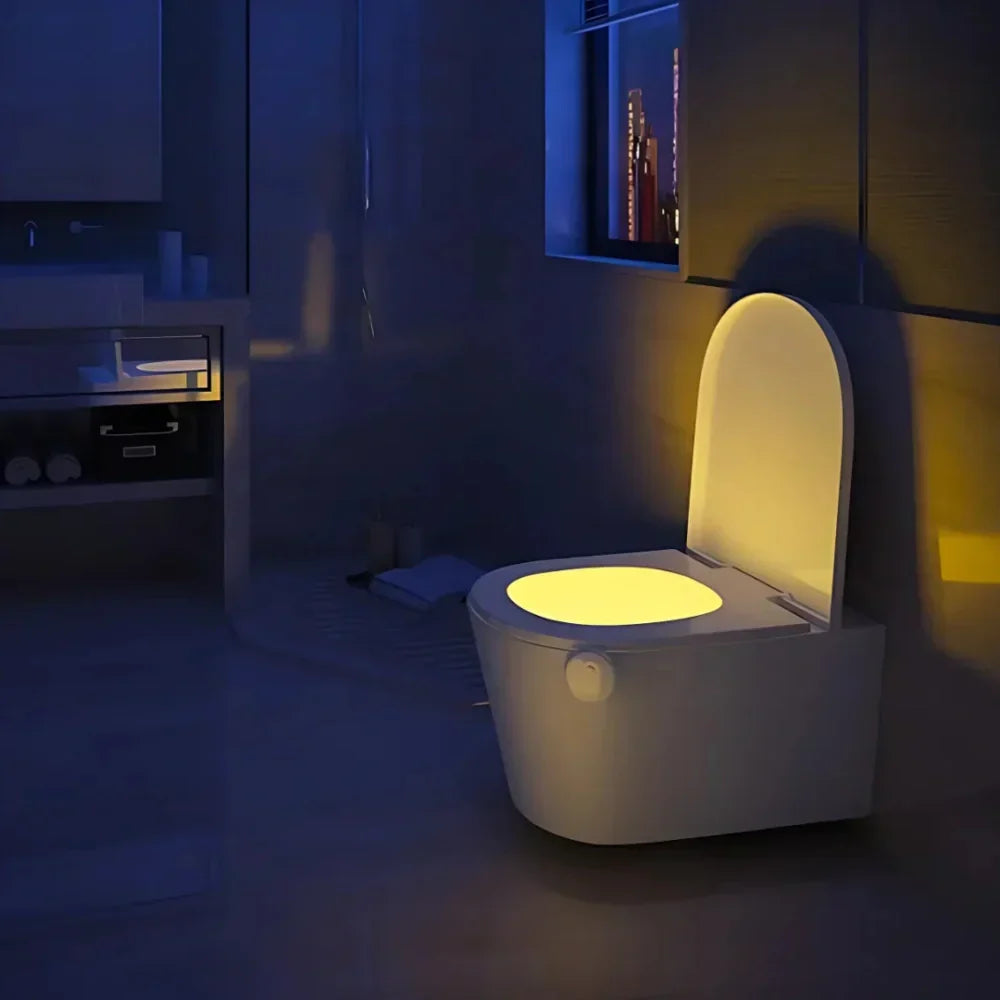 Motion sensor LED toilet night light with 8-color changing glow, perfect smart home bathroom essential.