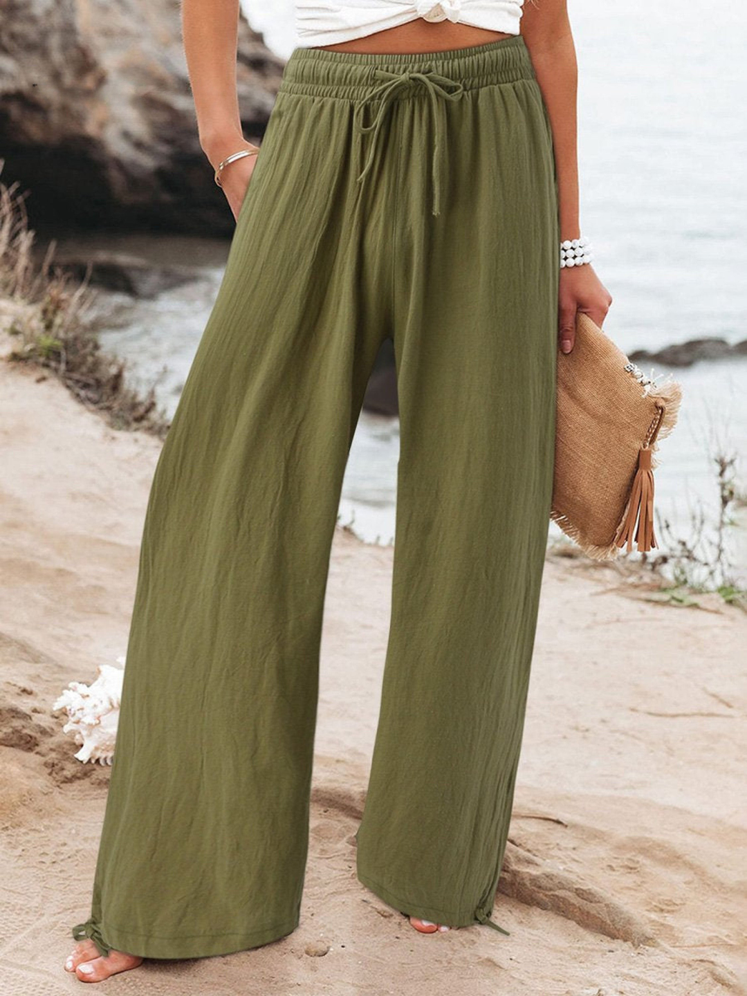 Versatile high-waisted wide-leg pants with a drawstring, suitable for chic casual summer outfits.