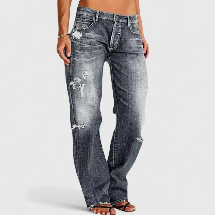 Casual women's distressed denim jeans featuring a trendy wide leg and comfortable relaxed fit for everyday style.
