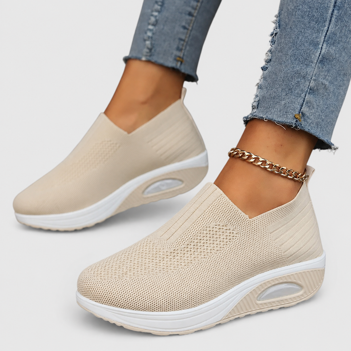 Supportive women's slip-on shoes, engineered with cushioned orthopedic arch support for lasting comfort.