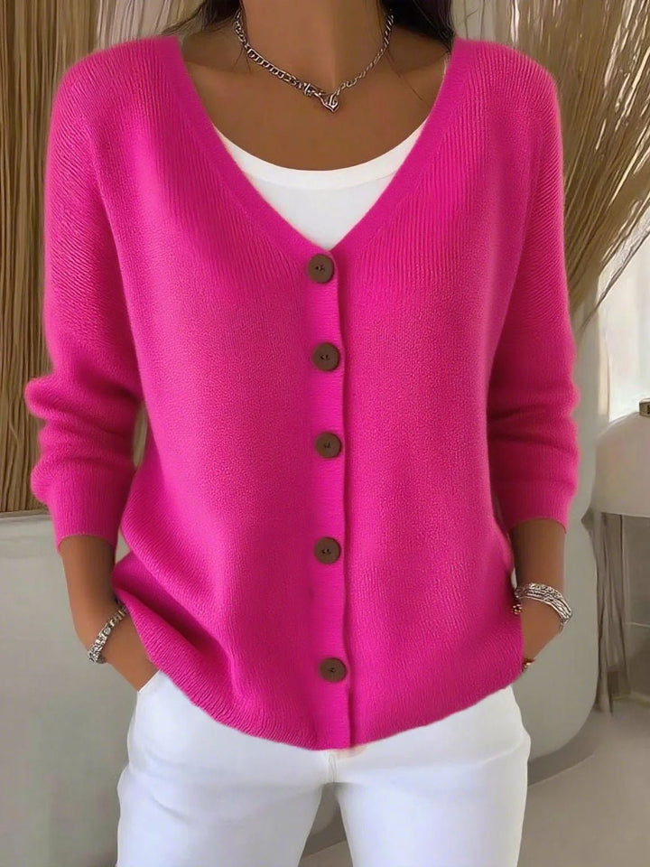Model wearing a comfortable long sleeve V-neck button knit cardigan, ideal for casual elegant outfits.