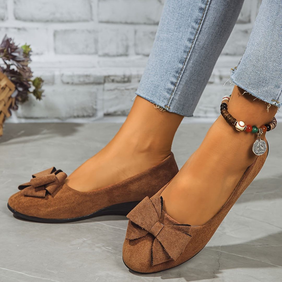 Stylish navy wedge ballet flats with bow detail, comfortable slip-on shoes for women's daily wear.