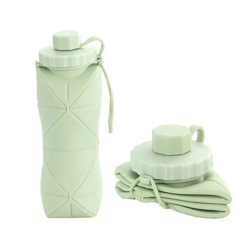 Reusable 20oz unisex collapsible silicone water bottle. Ideal for gym, hiking, and portable eco-friendly hydration.