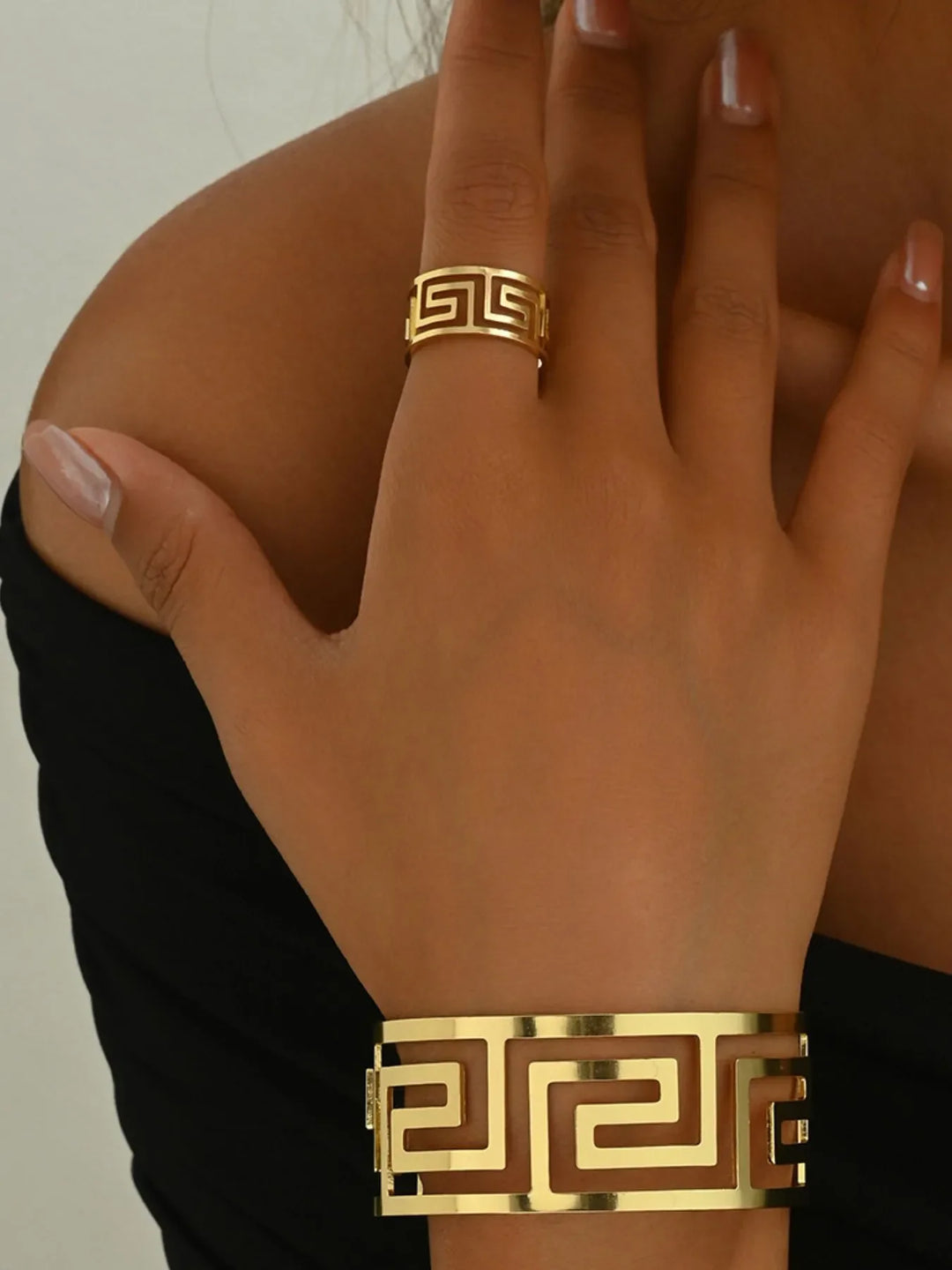 Women's 18K gold-plated geometric bracelet & ring set. Modern fashion jewelry, elegant accessory for her.