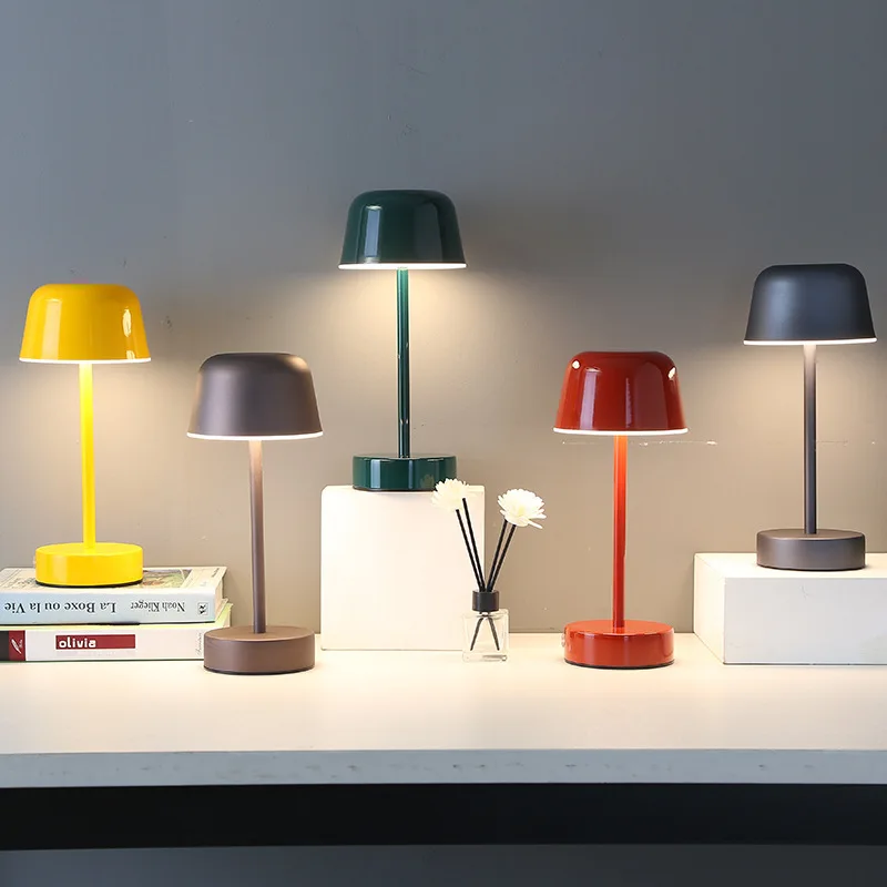 Stylish metal accent lamp, Nvroome, with a unique flare shape and dimmable cordless function.