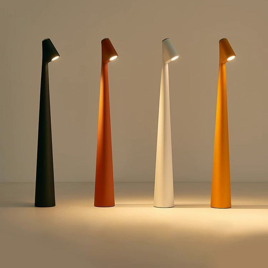 Portable dimmable LED table lamp with minimalist design, offering warm ambient light.