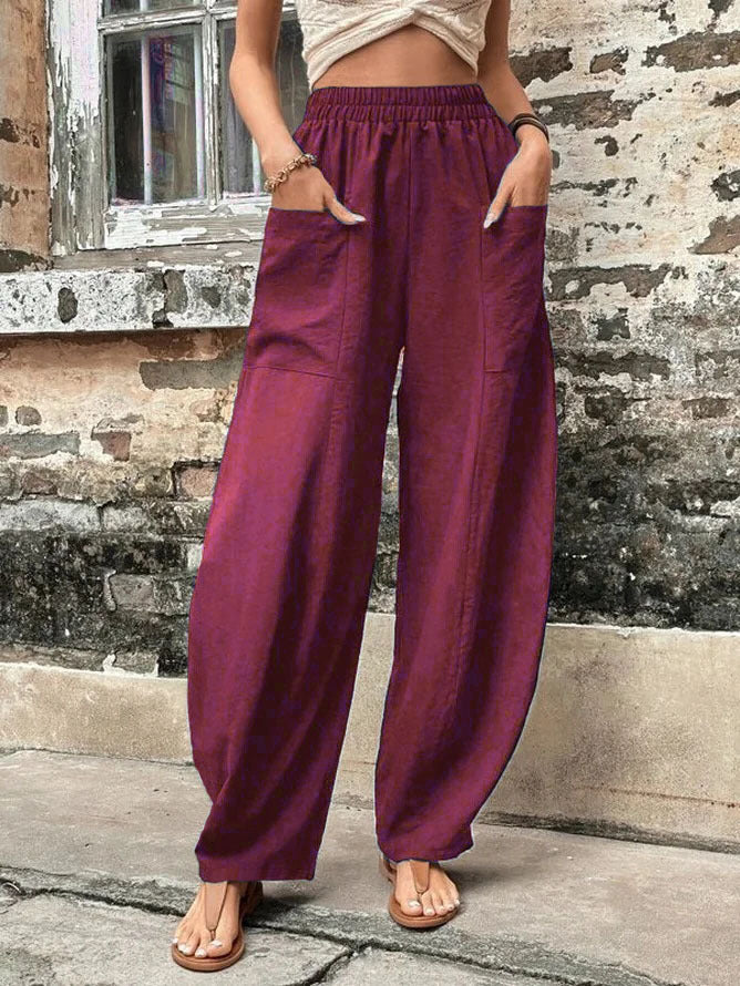Stylish women's wide-leg palazzo trousers with pockets, perfect blend of comfort and modern fashion.