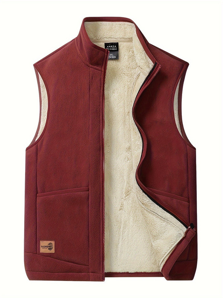 Unisex fleece-lined puffer vest. Warm, lightweight bodywarmer for winter layering. Features zippered pockets.