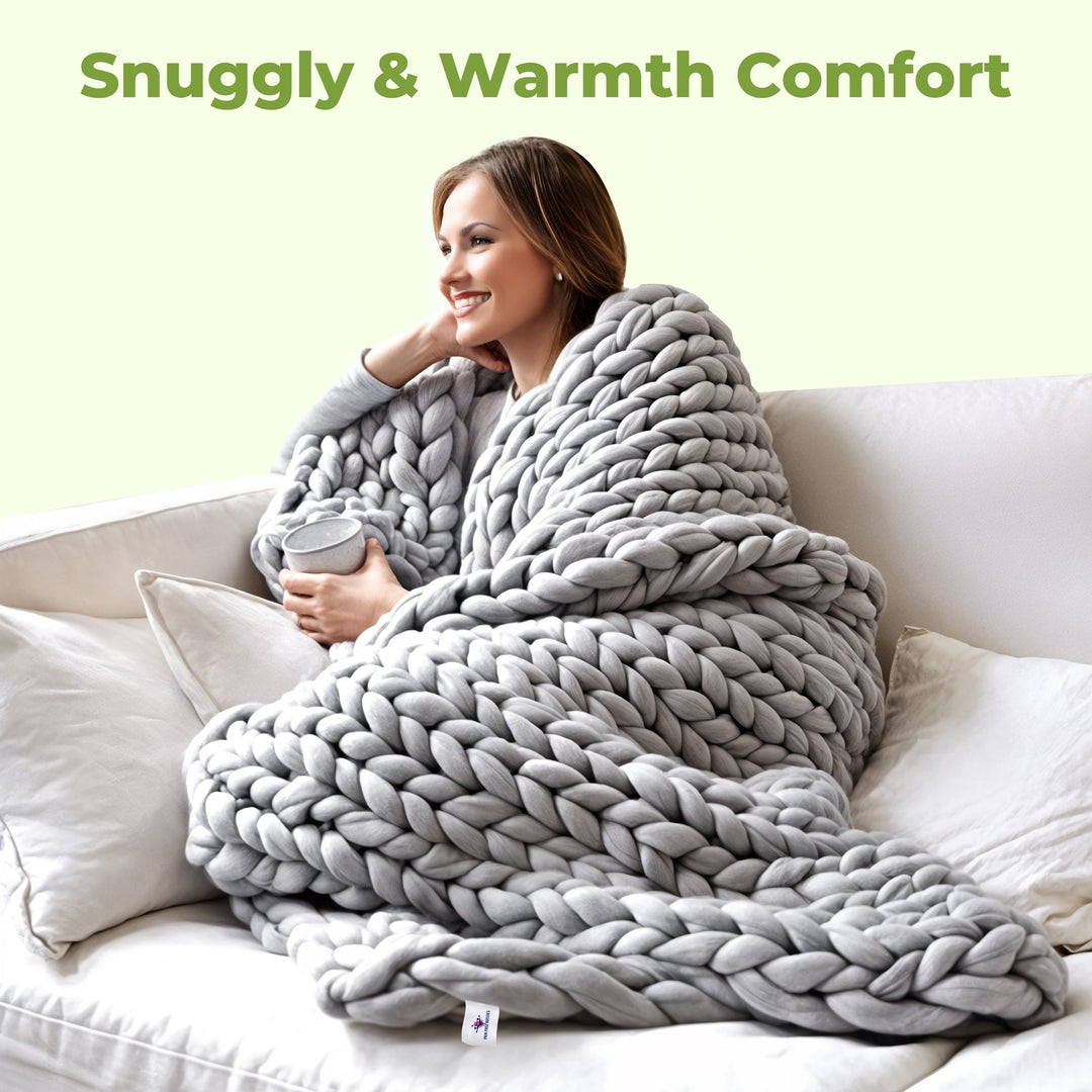 Stylish chunky knit throw blanket, handwoven for softness & warmth, perfect accent for living room decor.