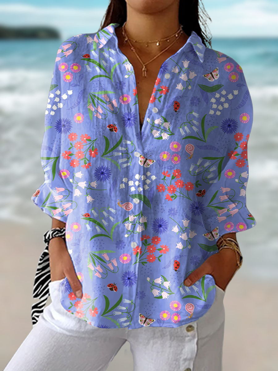 Women's flowy purple floral blouse with enchanting meadow print, perfect for spring & summer style.