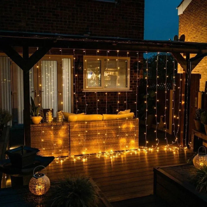 Nvroome warm LED string lights forming a stunning curtain, enhancing any indoor/outdoor space.