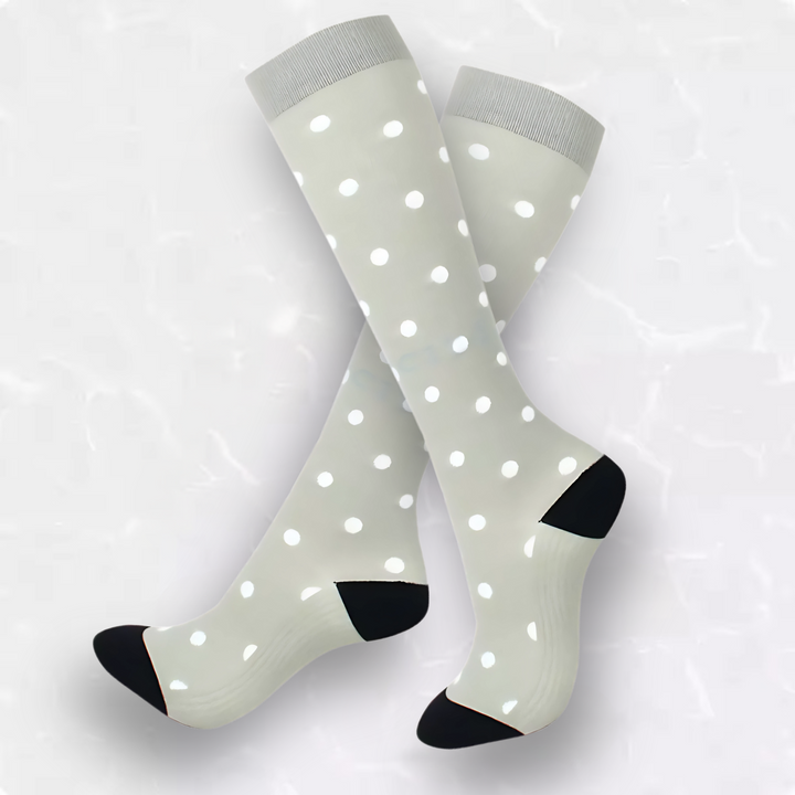 Comfortable unisex patterned compression socks with spotted design for active wear & foot support.