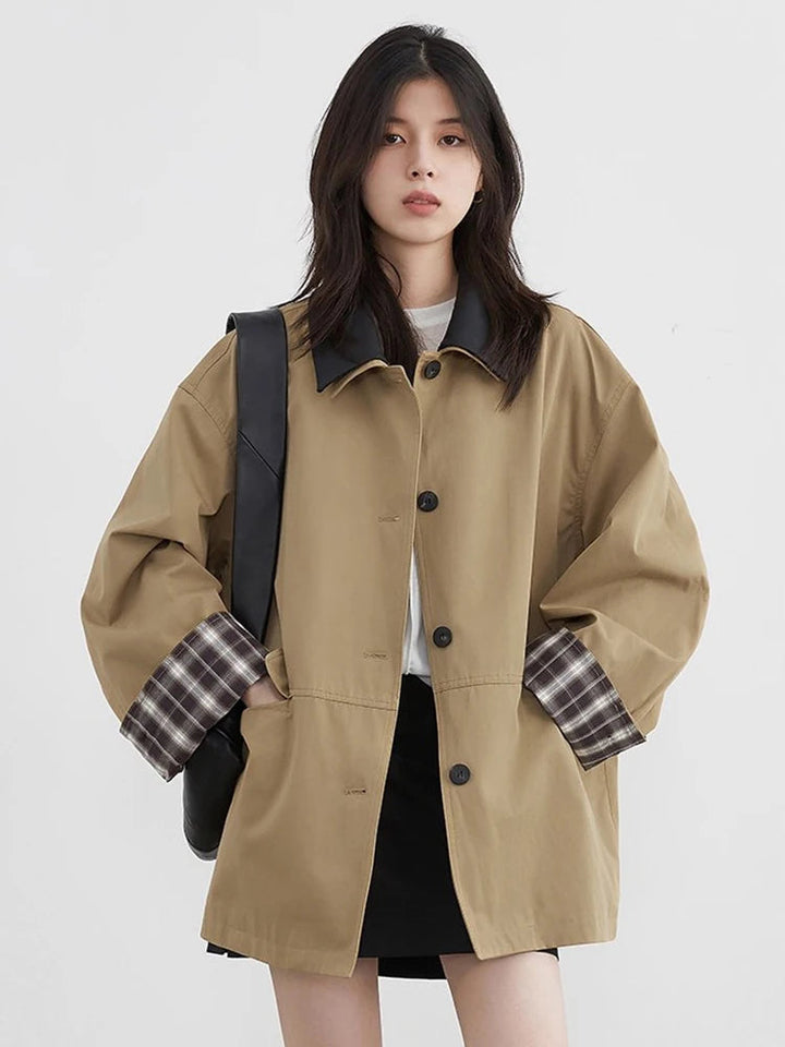 Women's fall button-up jacket, dark beige with prominent contrast trim, a versatile and fashionable layering piece.