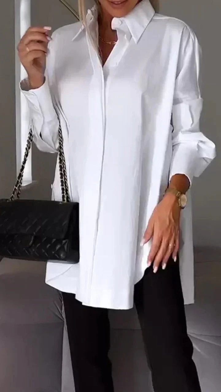 Elegant women's oversize blouse, chic loose fit top. Perfect for casual or dressed-up style.