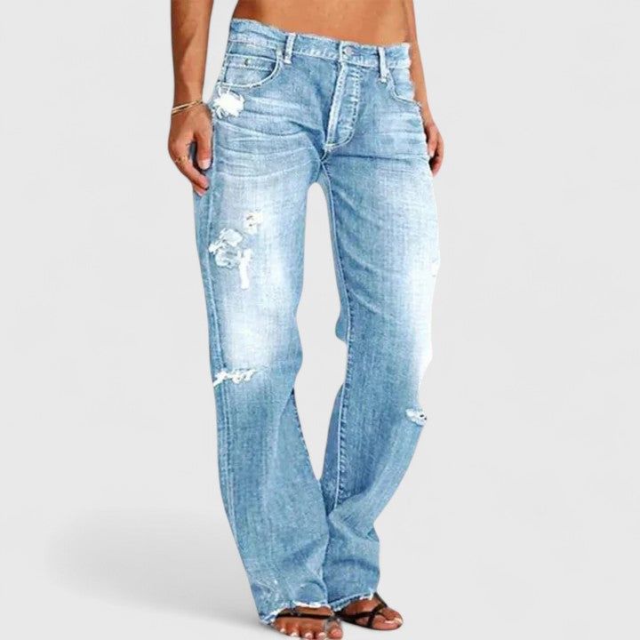 Stylish women's distressed wide leg denim jeans, mid-rise with a relaxed fit for trendy and comfortable street style.