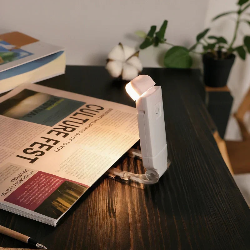 Portable clip-on book reading light with dimmable LED for eye comfort, ideal for night reading & travel.