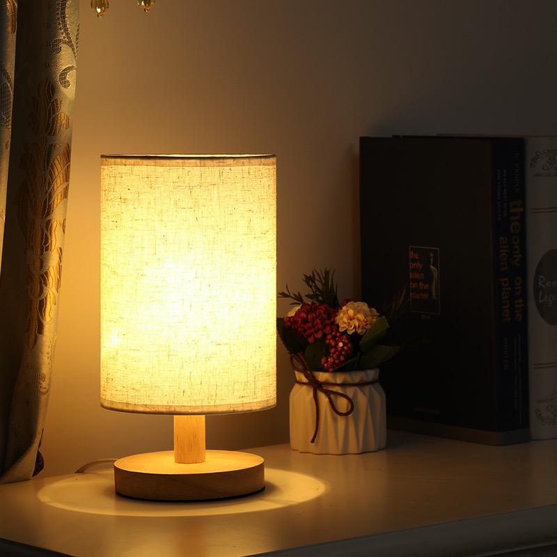 Ambient Dimmable Table Lamp with a unique organic glow, warm LED light, and sturdy wood base. Home essential.