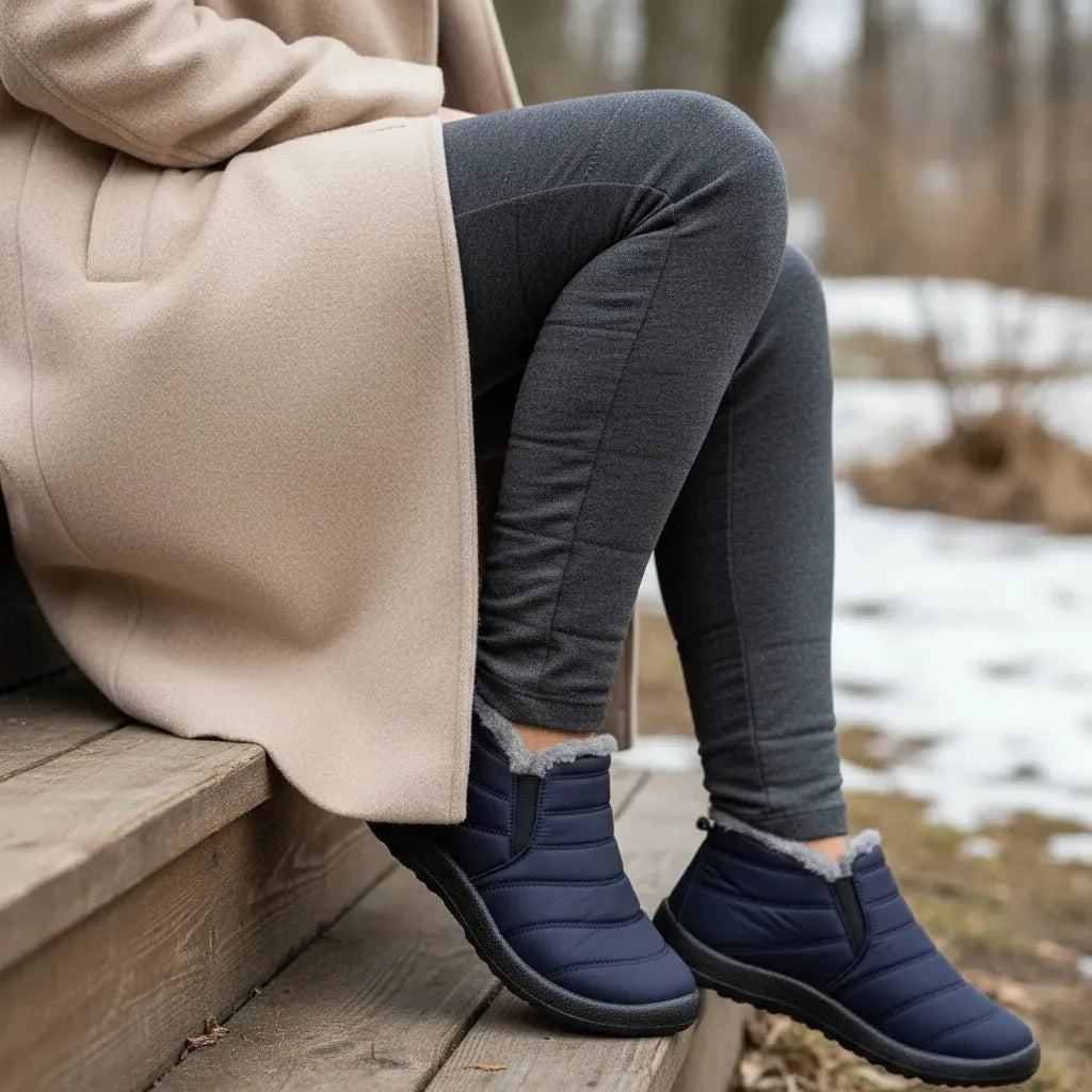 Women's waterproof snow boots with cozy lining, anti-slip for secure winter walking & warmth.