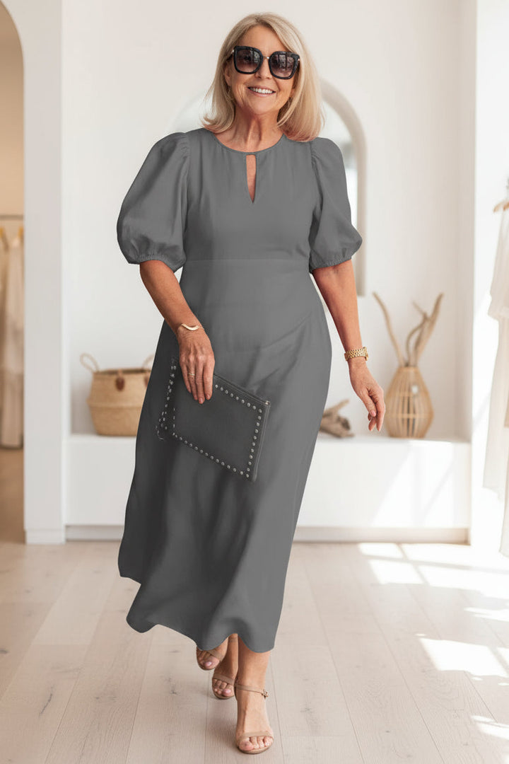 Breathable women's summer midi dress with tummy control, ideal for comfort and elegance in warm weather.