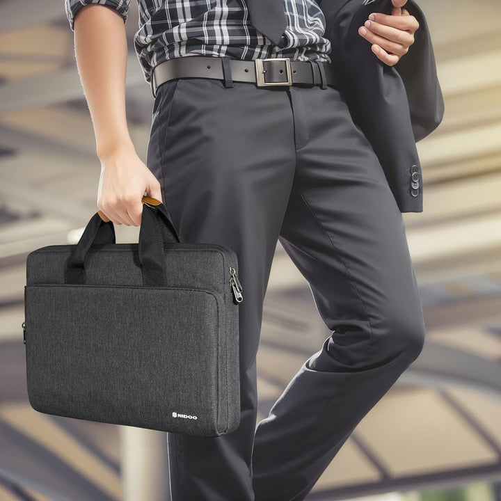 Unisex water-resistant laptop shoulder bag, 360° protective, essential for remote work setups.