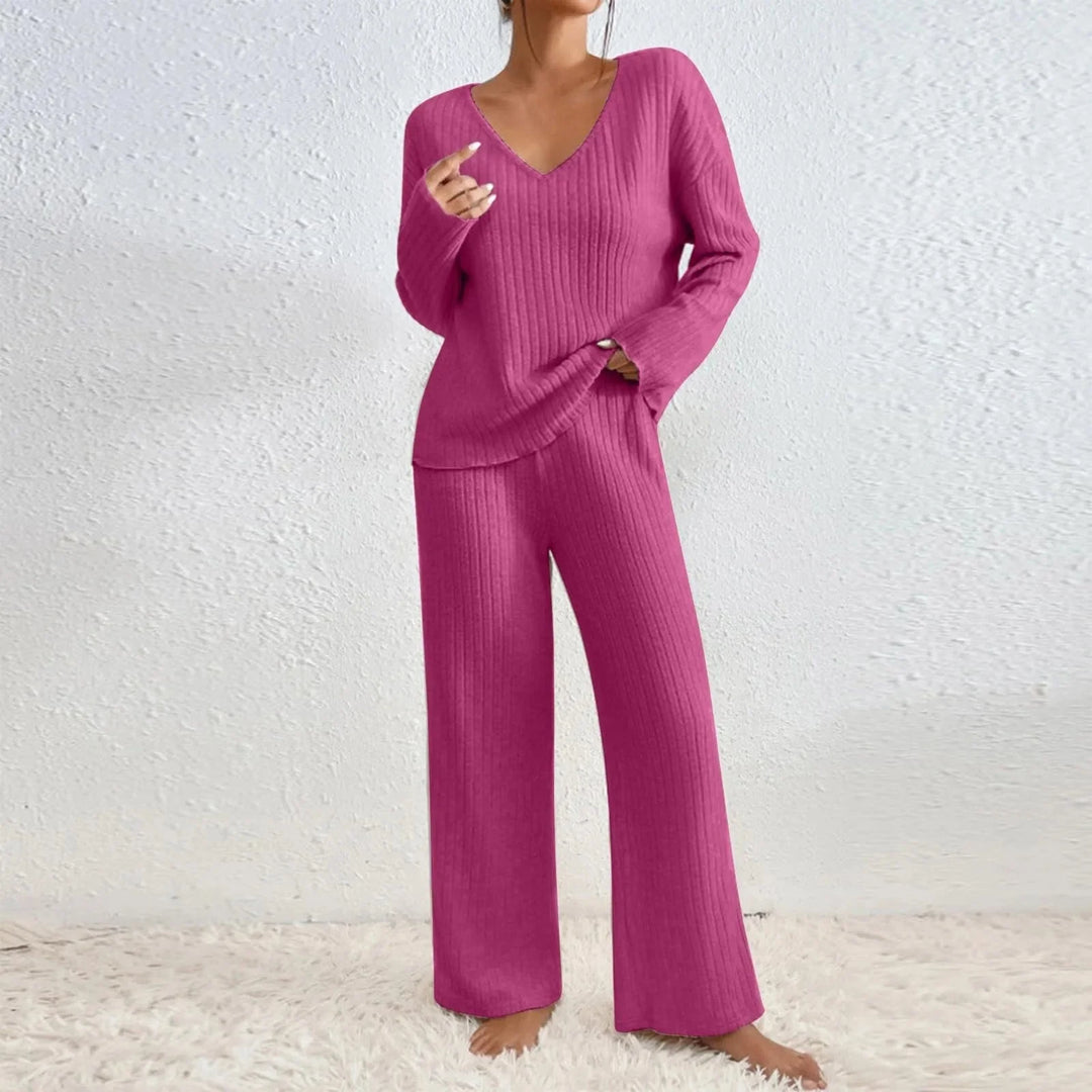 Fashionable women's cozy travel set, including a comfortable sweater and matching casual pants.