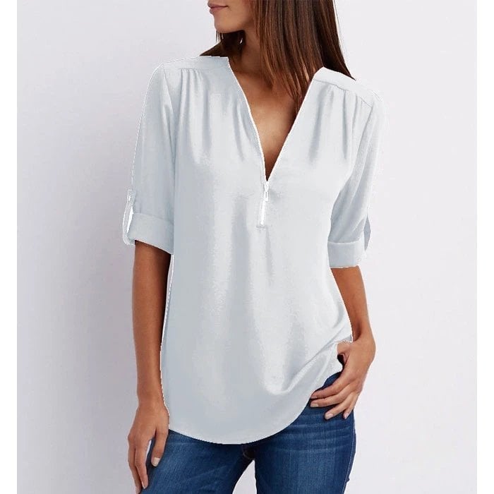 Close-up of a versatile women's 3/4 sleeve V-neck blouse, showcasing the elegant zip detail and relaxed fit.