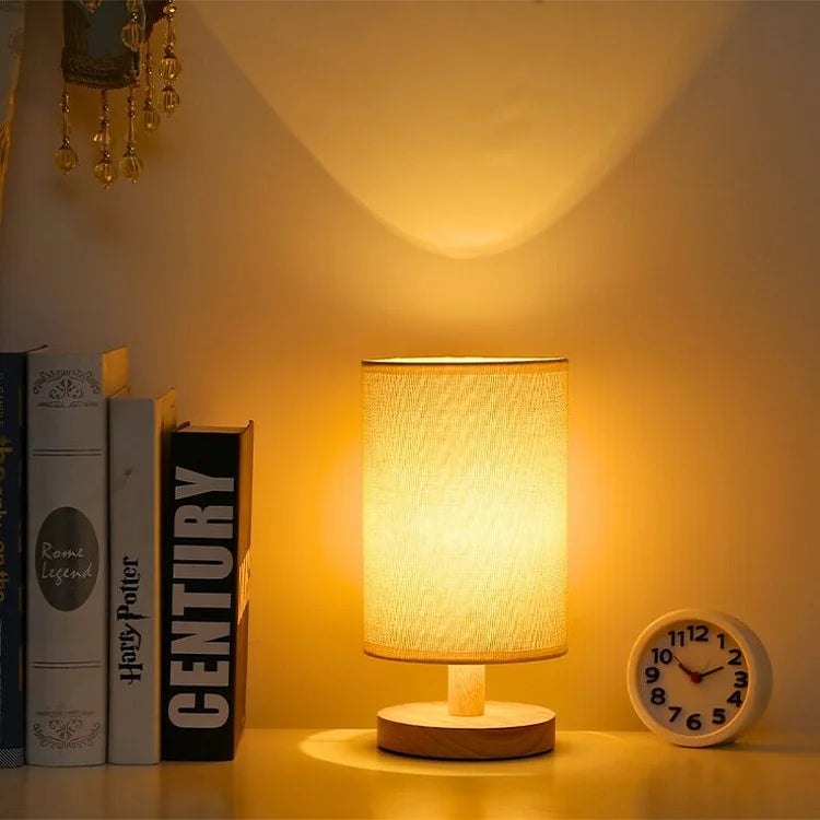 Organic Glow Table Lamp in a contemporary living room setting, highlighting its dimmable feature & wood base.