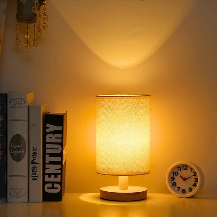 Organic Glow Table Lamp in a contemporary living room setting, highlighting its dimmable feature & wood base.