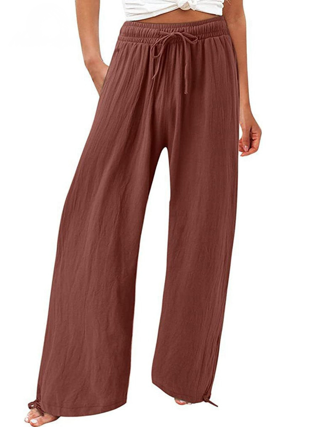 Flowy women's wide-leg drawstring pants, high-waisted for a comfortable, chic look, perfect for summer.