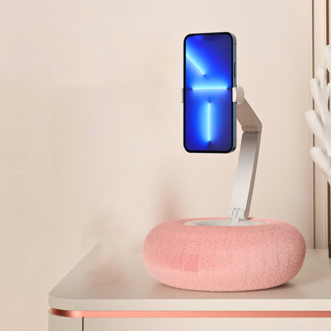 Plush phone & tablet holder pillow. Offers soft, adjustable, hands-free support for ultimate comfort.