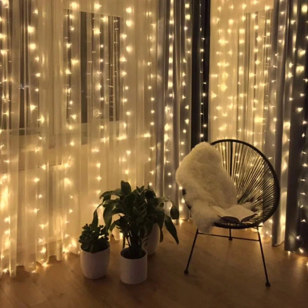 Decorative warm white LED curtain lights, creating a magical fairy-tale effect indoors.