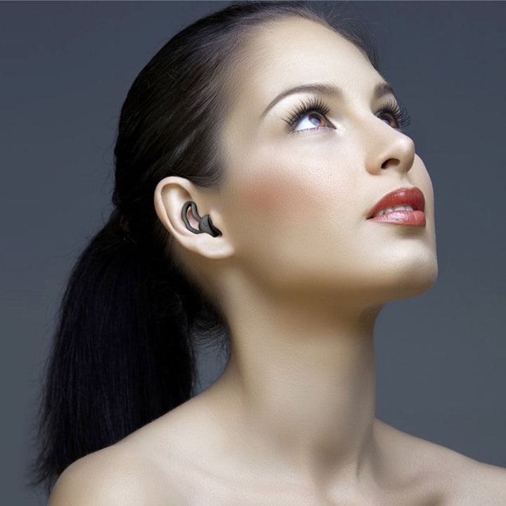 Close view of the texture of a calming silicone earplug, designed for quiet.