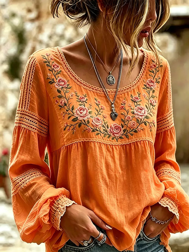 Comfortable women's long sleeve top with subtle embroidery, a versatile and flowy casual spring blouse.