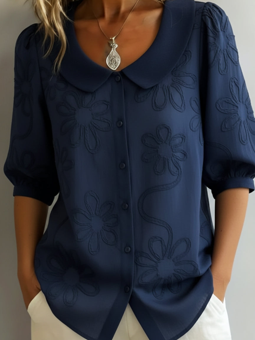 Women's knit floral print blouse with Peter Pan collar & half sleeves. An elegant & versatile spring/summer top.