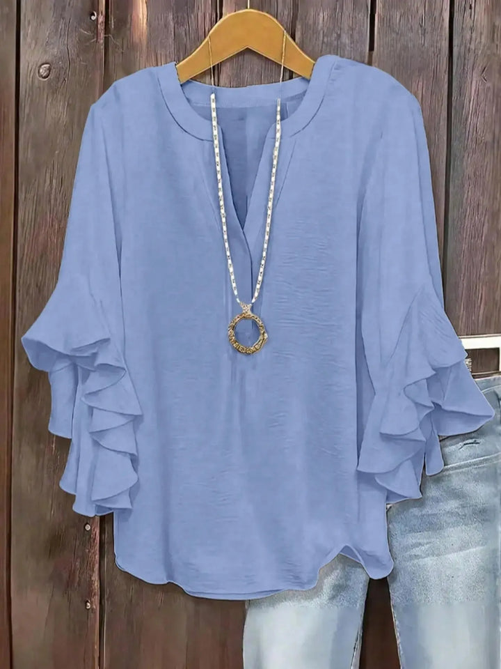 Summer-ready women's casual blouse, featuring a V-neck and comfortable short sleeves.