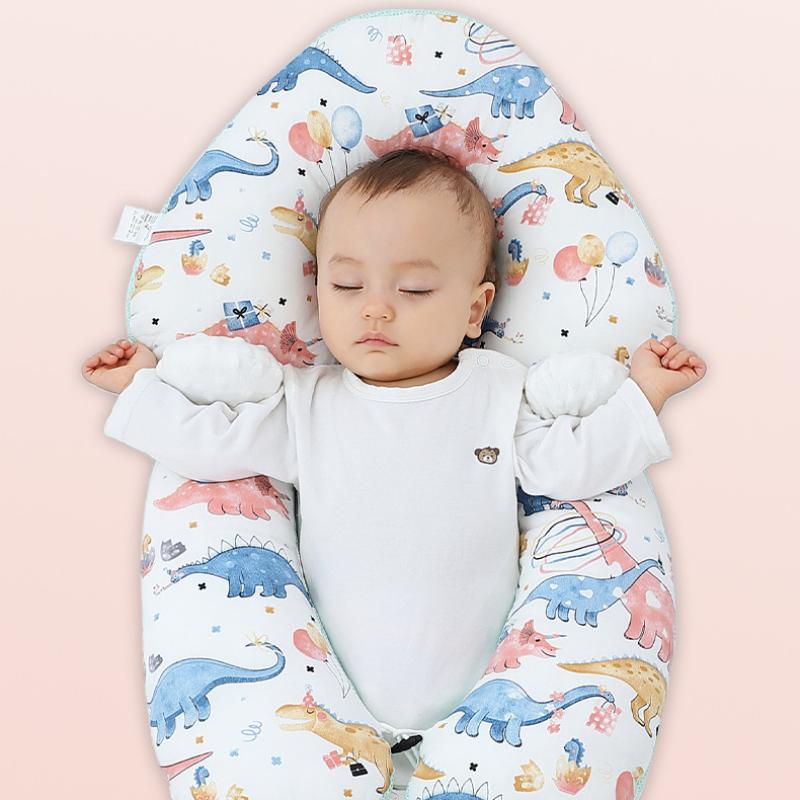 Ergonomic infant pillow for safe, comfortable sleep & newborn support. Made with gentle, breathable cotton.