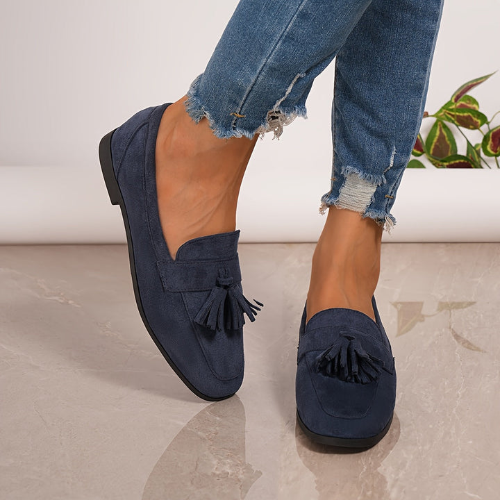 Stylish women's navy blue tassel loafers, perfect elegant slip-on footwear for daily fashion.