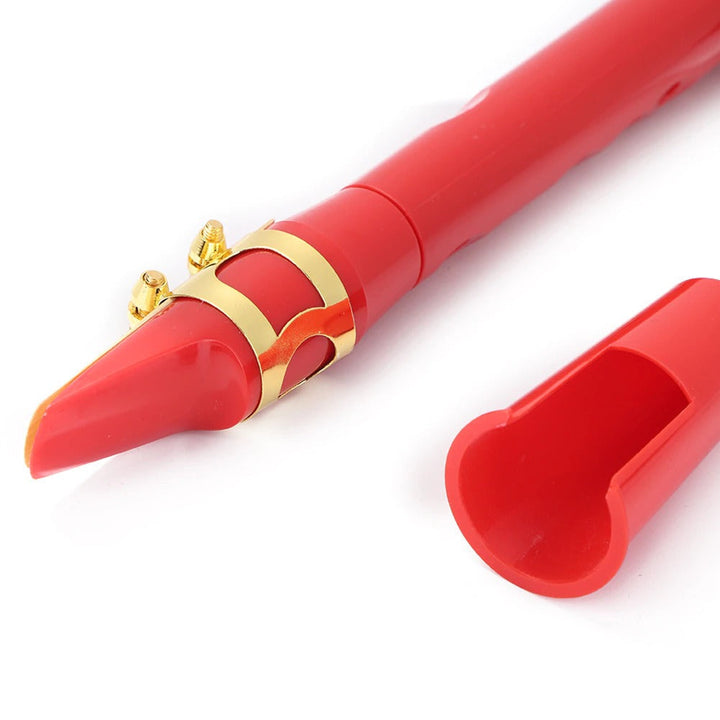Close-up of portable mini saxophone & alto mouthpiece, highlighting its compact design for musicians.