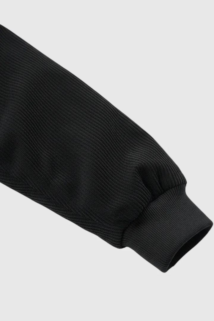 Stylish men's black corduroy jacket, a classic button-front outerwear piece for casual fall and spring fashion.
