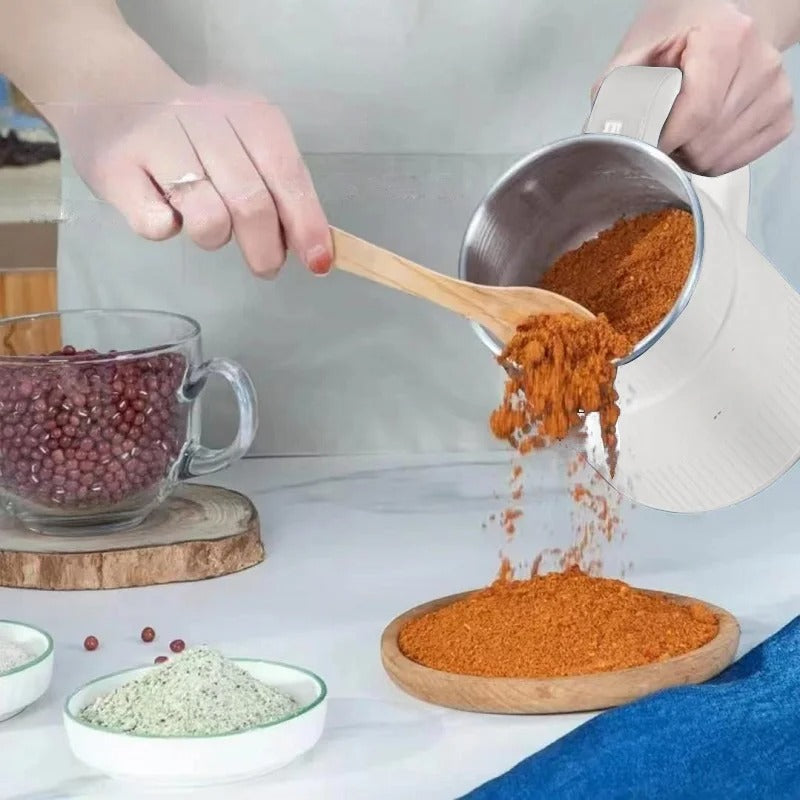 Compact electric grain mill, perfect for making fresh flour from various grains. Ideal home kitchen appliance.