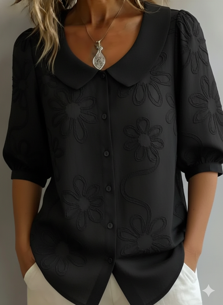 Refined knit texture women's floral print blouse with elegant Peter Pan collar. A stylish summer top.