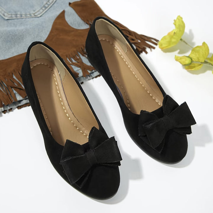 Navy women's low wedge ballet flats, versatile slip-on footwear with a round toe and cute bow.