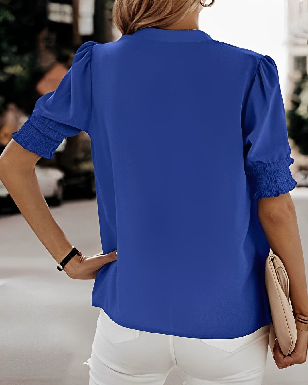 Elegant women's puff sleeve V-neck top. Short sleeve blouse for spring fashion & comfortable style.